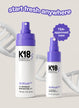 Full size bottle of airwash next to the mini airwash dry shampoo bottle.